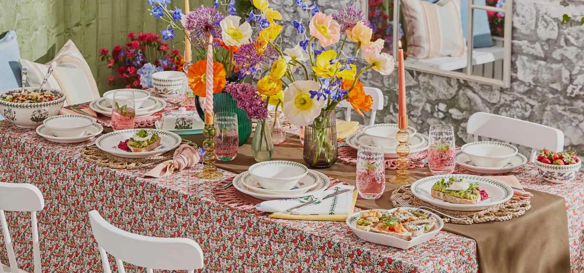 A warm table arranged with everyday ceramics and serving pieces